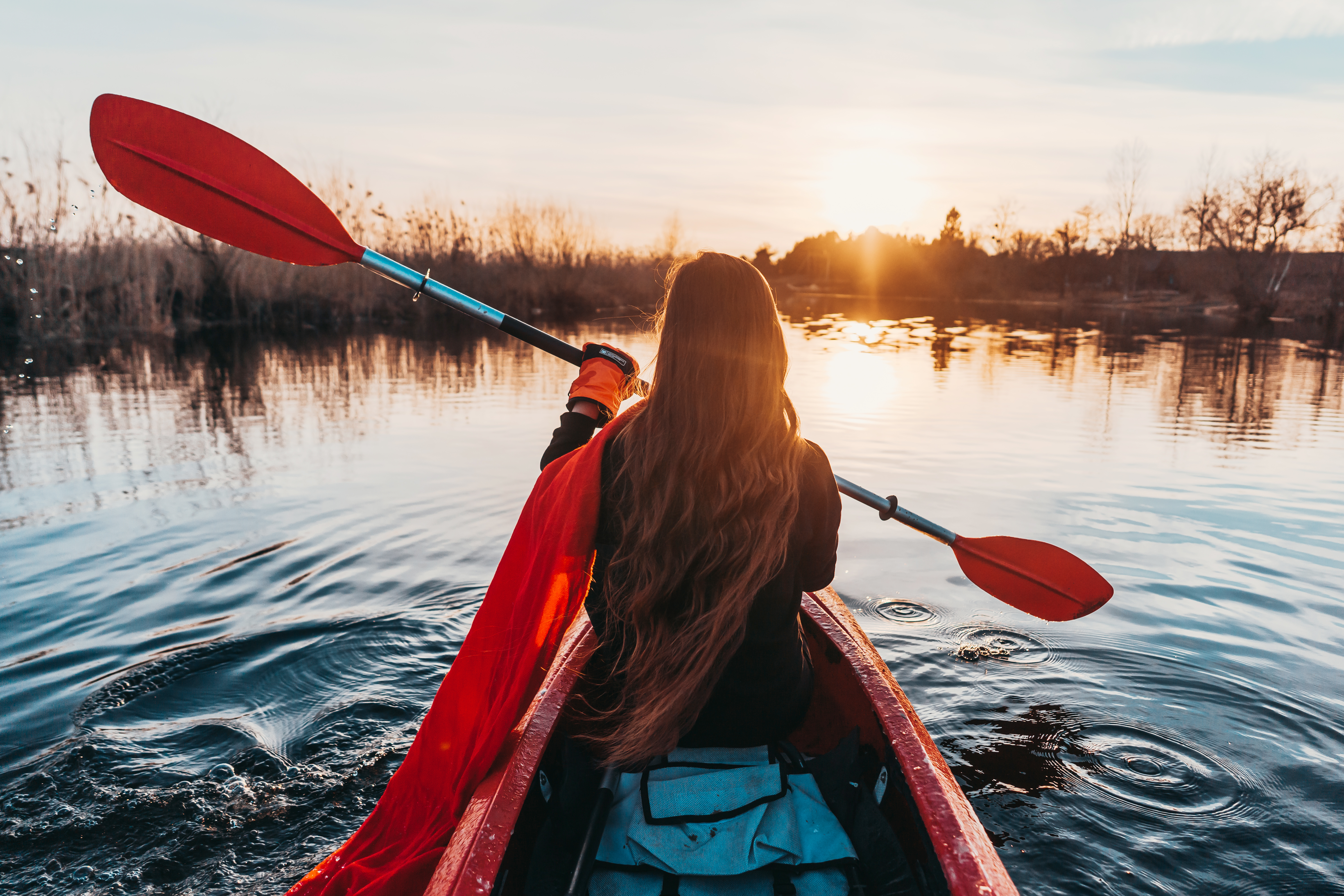 woman-holding-paddle-kayak-river.jpg